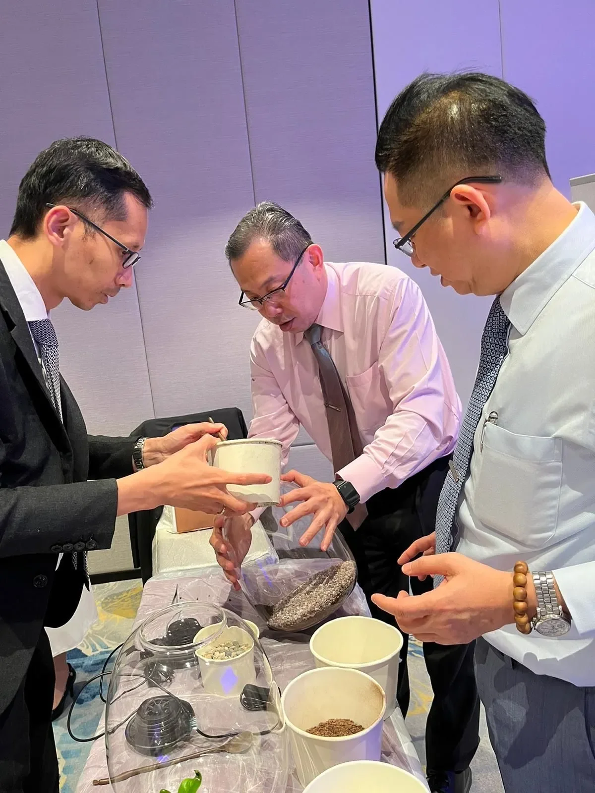 Heads of Departments crafting terrariums during the hands-on sustainability workshop