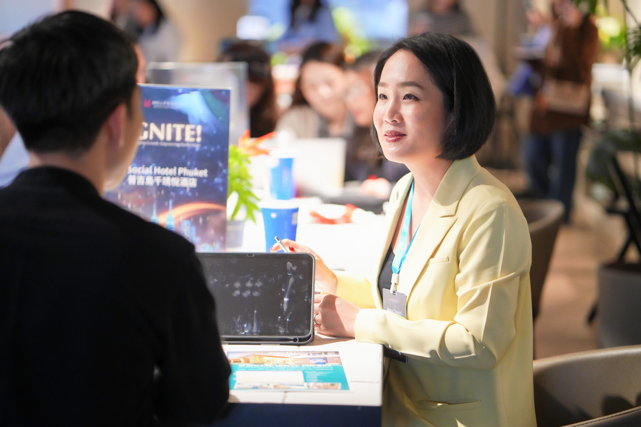 Showcasing opportunities and experiences: A sales representative engages with a prospective partner at IGNITE! Taipei.