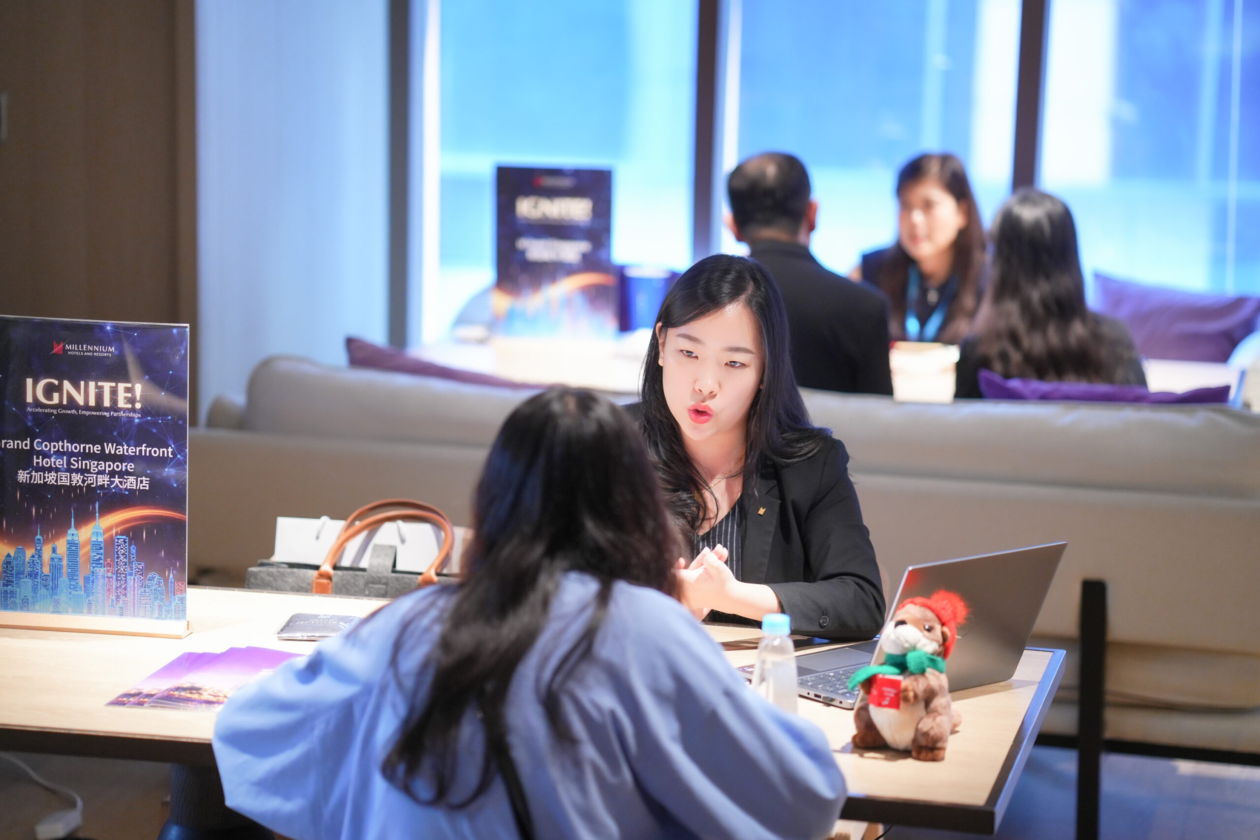 Meaningful conversations in motions: Face-to-face business exchange between a hotel representative and a local client at IGNITE! Taipei.