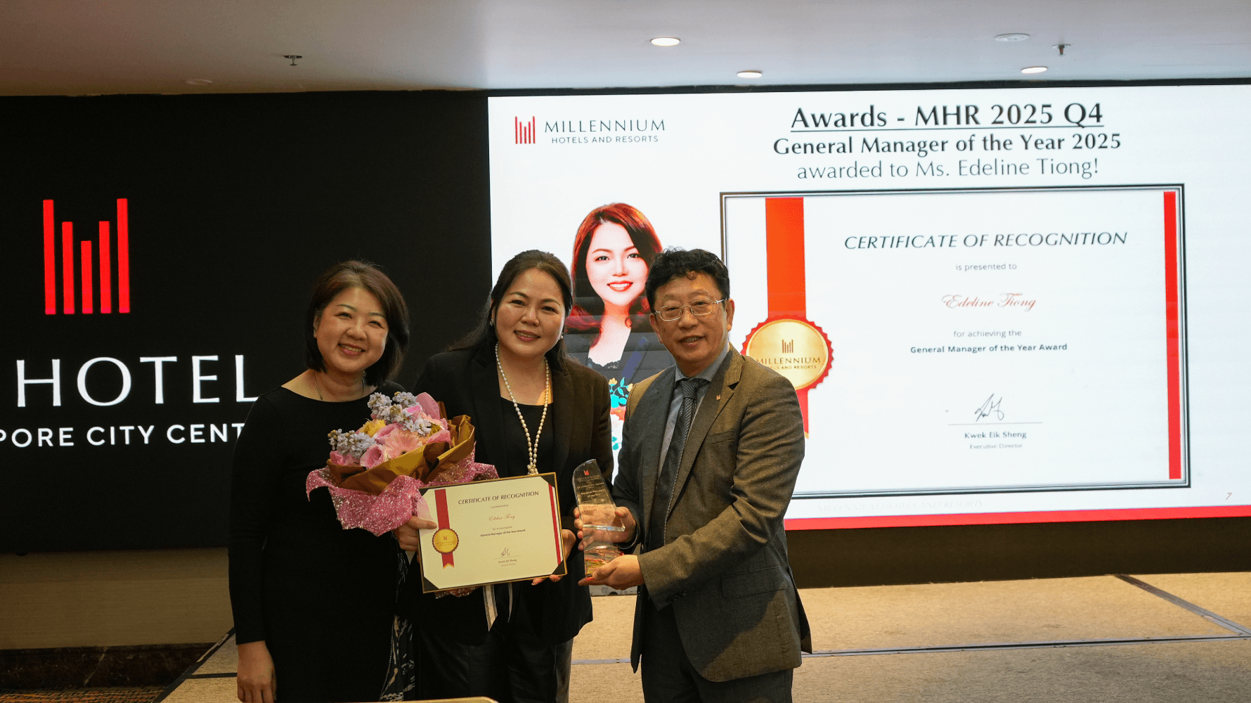 General Manager, Ms. Edeline Tiong accepts the accolade from Benedict Ng, Vice President of Operations, SEA as well as Yvette Tan, Director of Human Resources, Asia