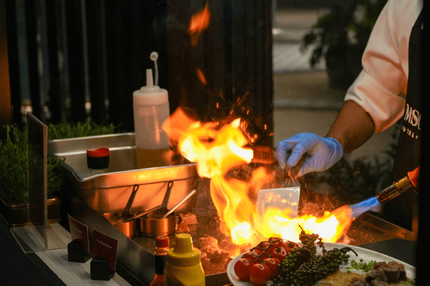 A chef prepares canapes at the Borderless Wine event, M Social Hotel Phuket.