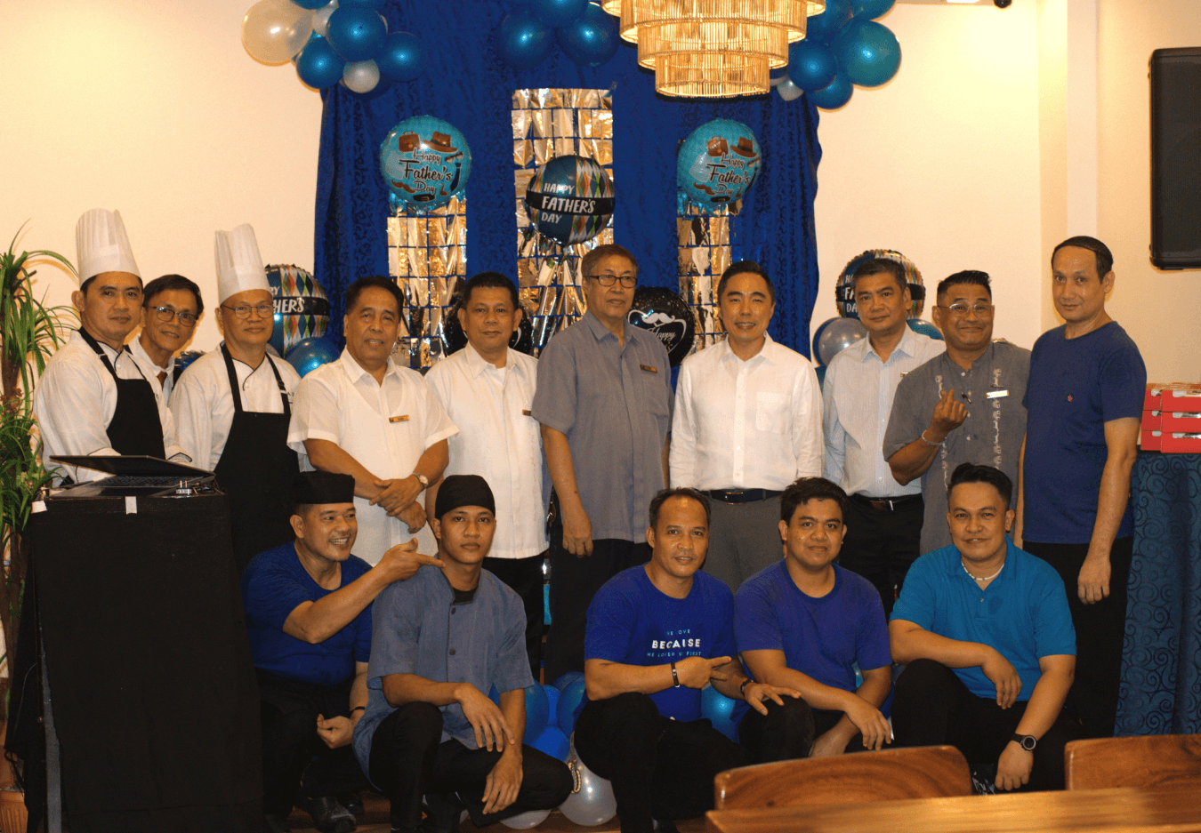 Employees gather beneath the balloon decorations at the Father's Day luncheon at The Heritage Hotel Manila.