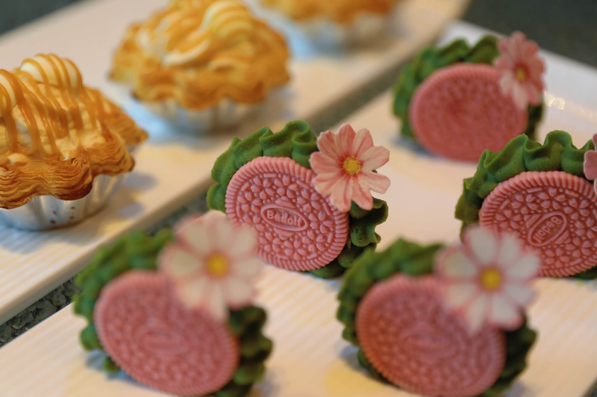The Cherry Blossom Pistache Cake, finished with sugar blossoms.