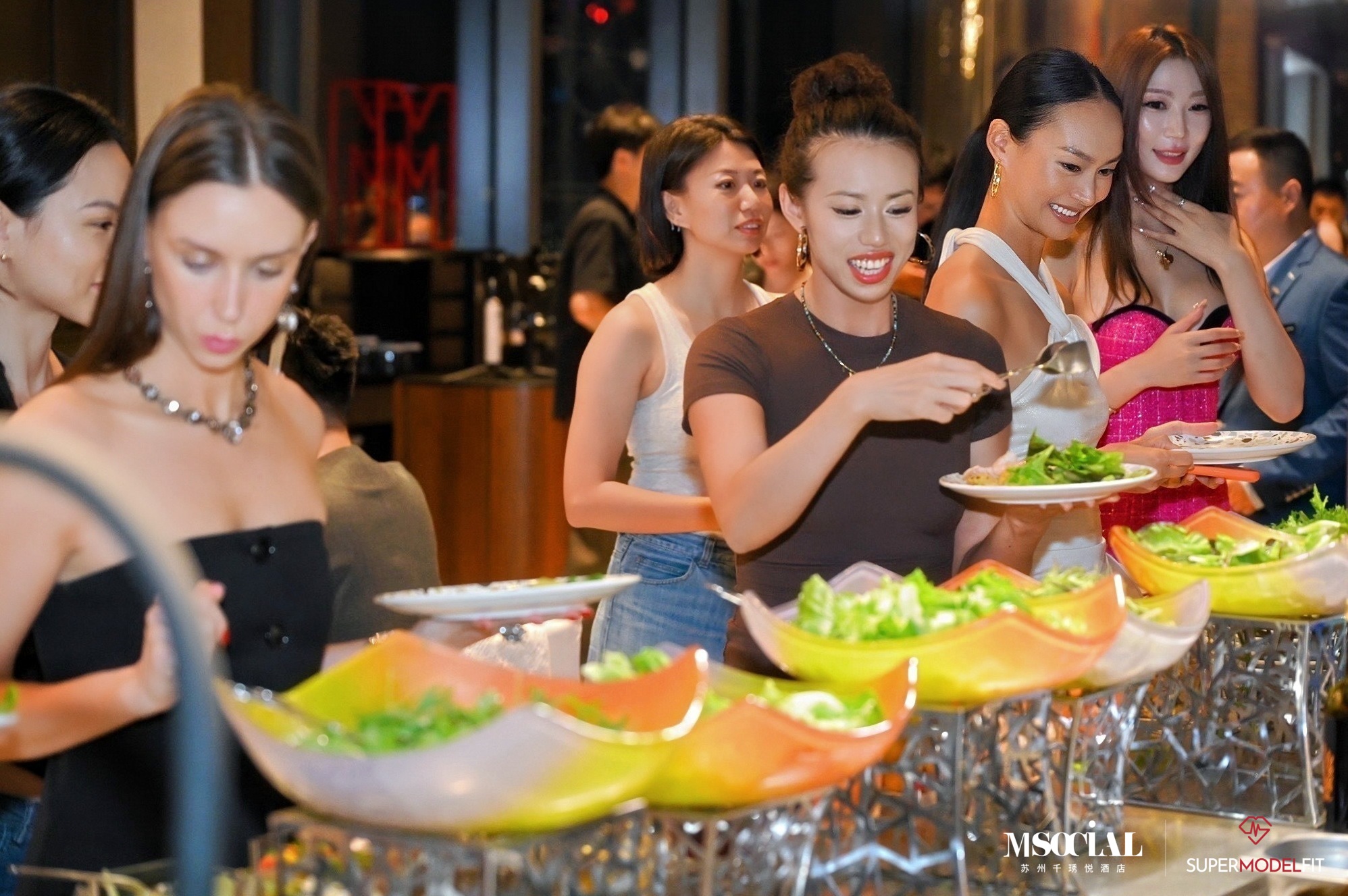 Key opinion leaders at the salad bar during the Revive & Glow Dinner Feast.