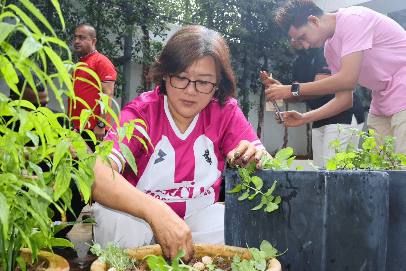 Jasmine Keh is a hands-on General Manager, pictured here planting a potted plant at M Social Resort Penang.