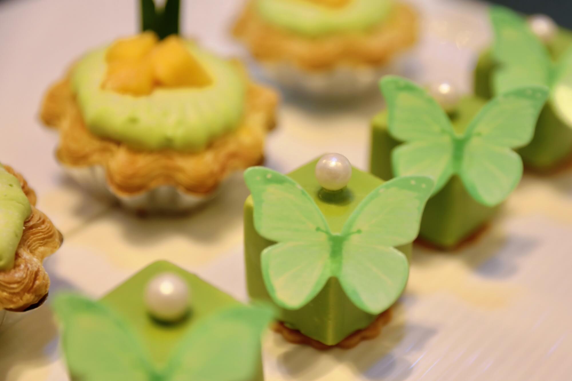 The Matcha Mousse, topped with a sugar butterfly, at the Lobby Lounge.