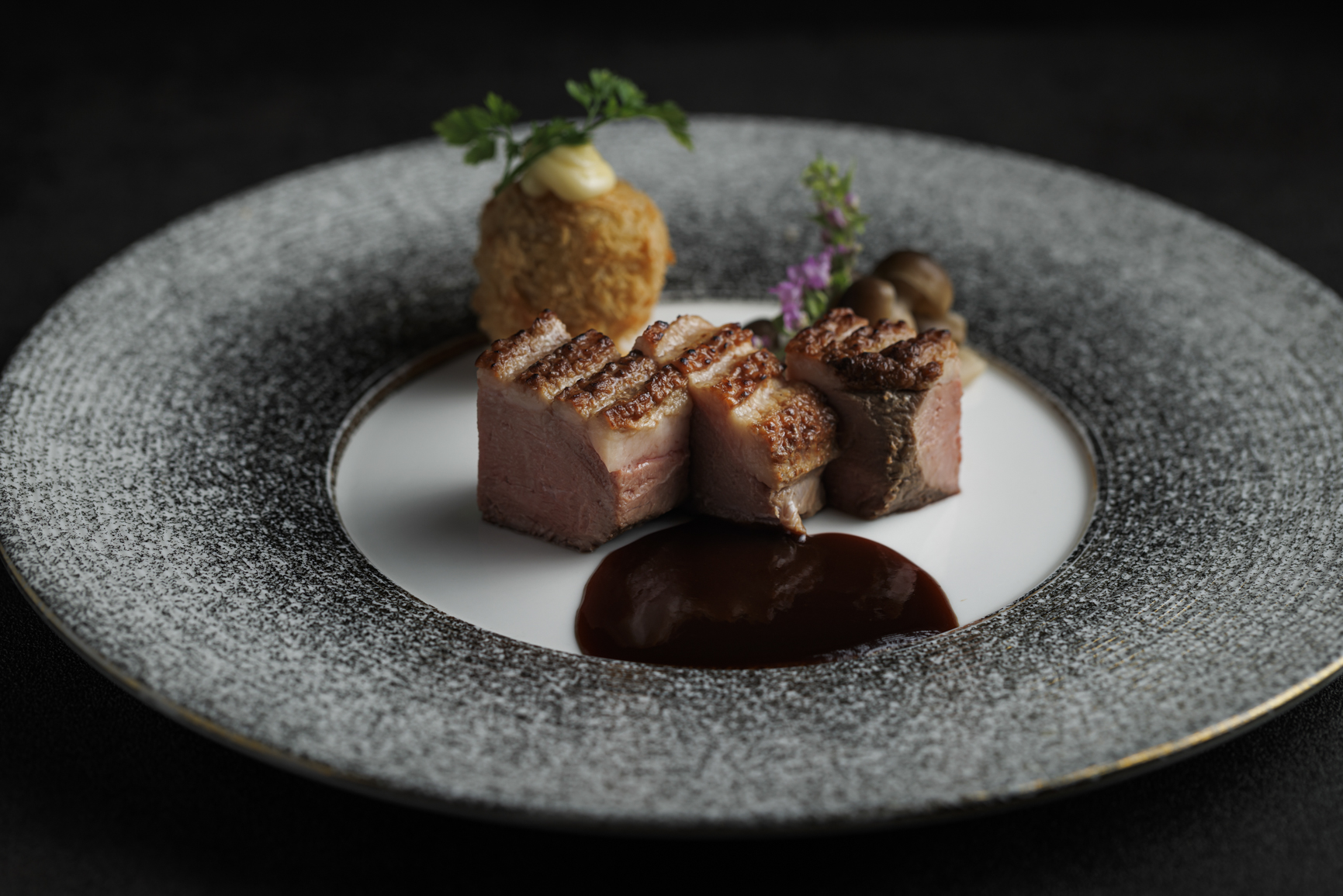 Kyoto-style seared duck breast, glossed with Exotica Umami sauce.