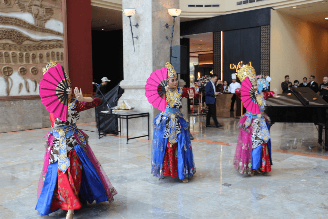 Dancers perform in the lobby at the Cafe Sirih reopening.