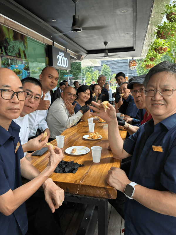 Colleagues from across the departments share the spread at M Bar.