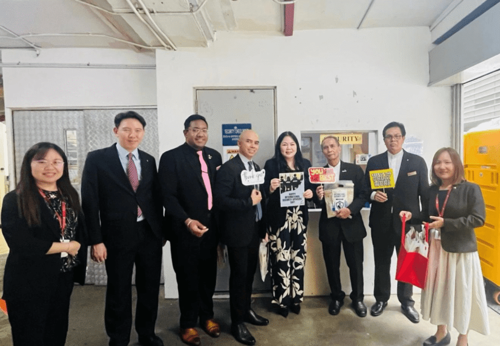 Miss Edeline Tiong, General Manager, fifth from left, with colleagues marking the day on 24 July.
