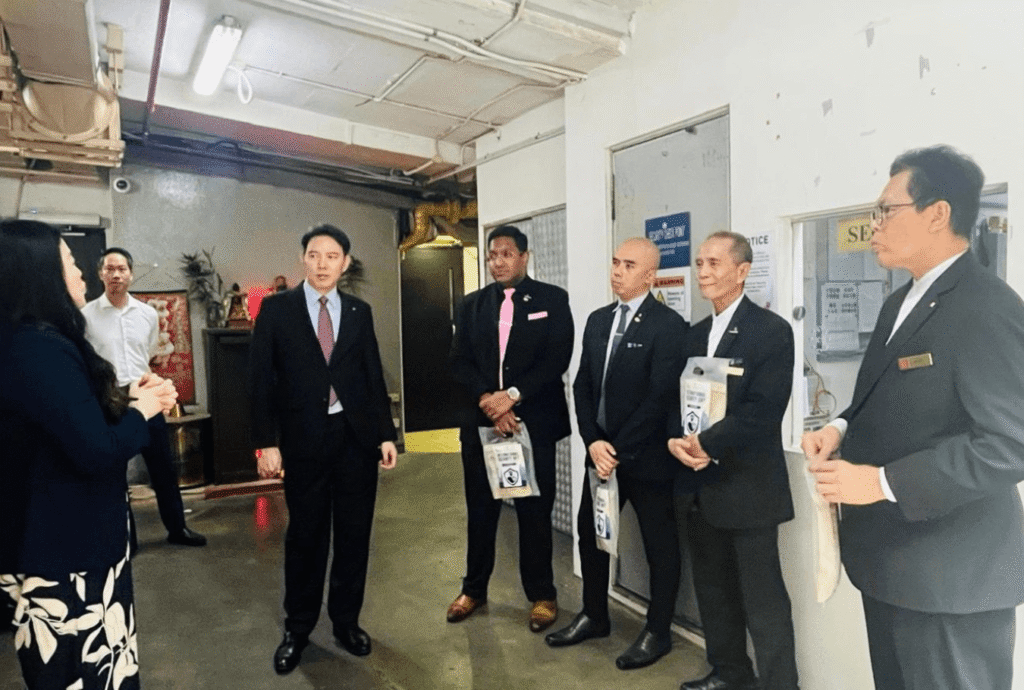 Miss Edeline Tiong, General Manager, with the security team on International Security Day.