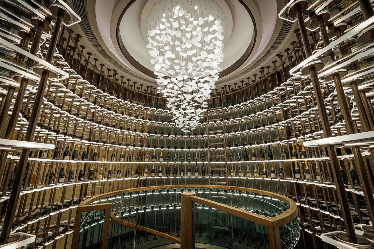 The hotel's circular wine display, rising through several levels beneath a cascading chandelier.