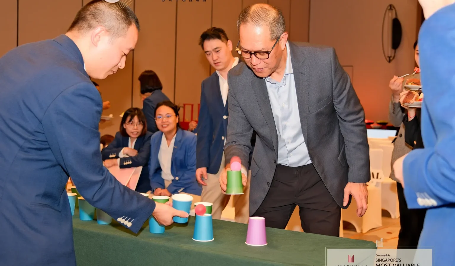 General Manager Peter Low participating in an interactive team-building game during the anniversary celebration