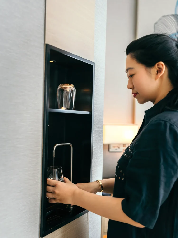 In-room filtered water dispensers eliminate the need for single-use plastic bottles throughout the property