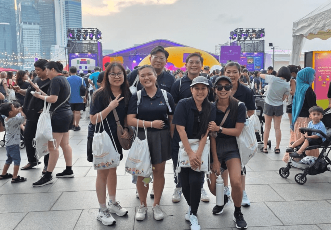 Team members from M Hotel Singapore City Centre gather at Marina Bay before the evening walk.