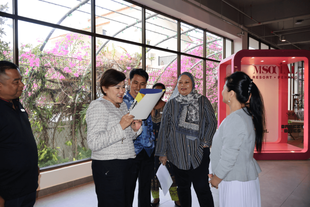 Ms. Jasmine Keh reviews the official grading documentation with the inspection panel, ensuring every detail of the resort's service delivery meets the high-performance criteria required for a 4-star classification.