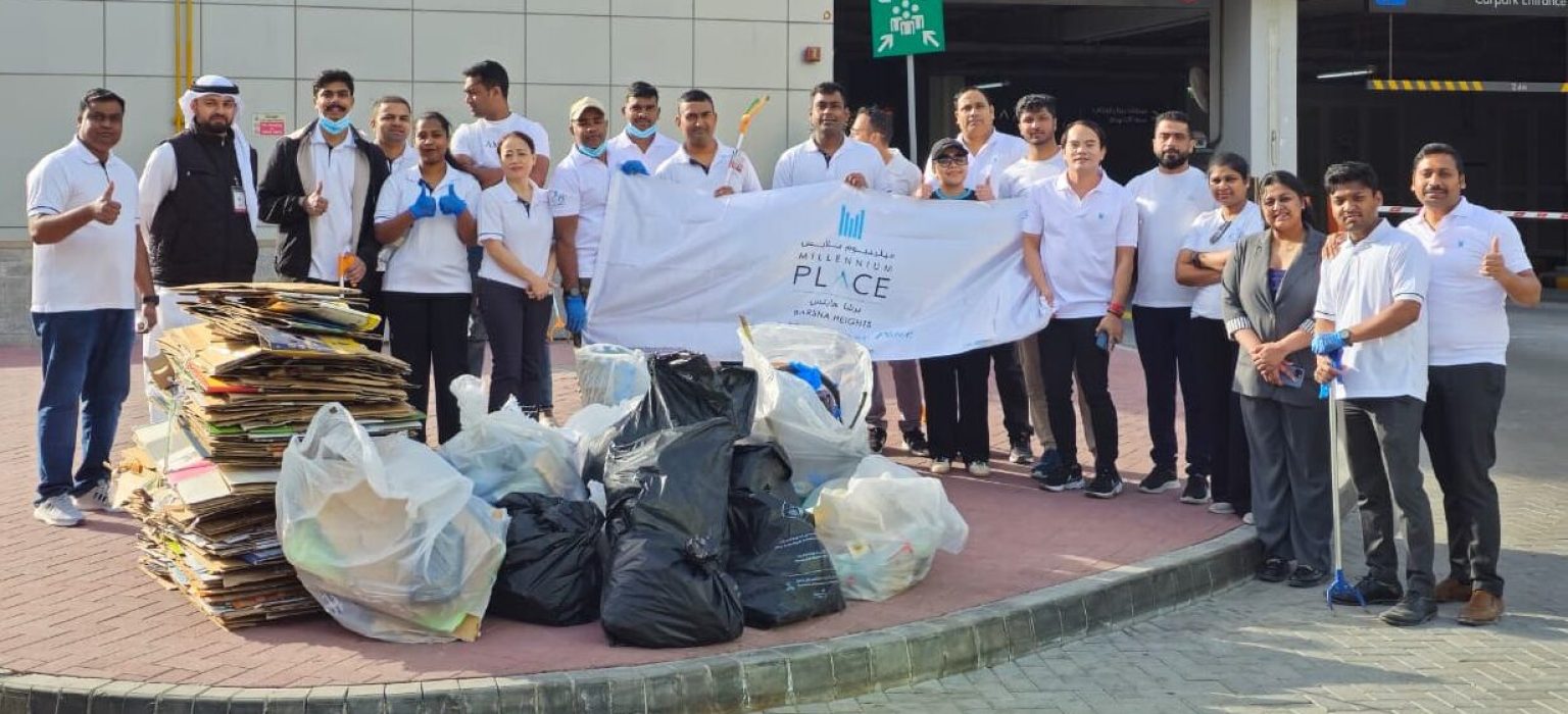 Millennium Place Barsha Heights Hotel team members collaborating with Dubai Municipality to maintain the environmental standards of the local district.