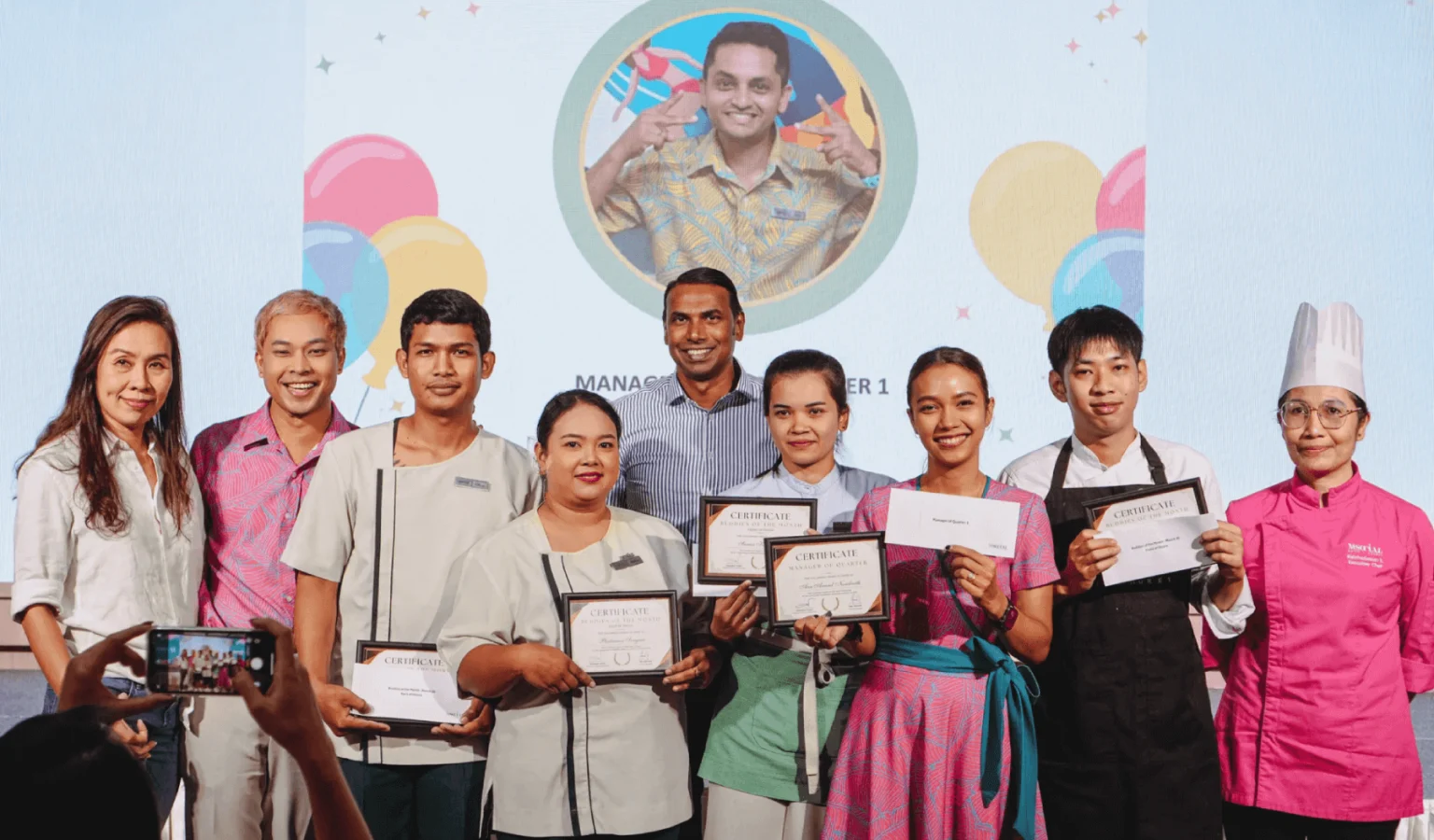 General Manager Pjey Mayandi (centre) welcomes new buddies and team members at the Town Hall Event, setting the tone for M Social Hotel Phuket's inclusive culture