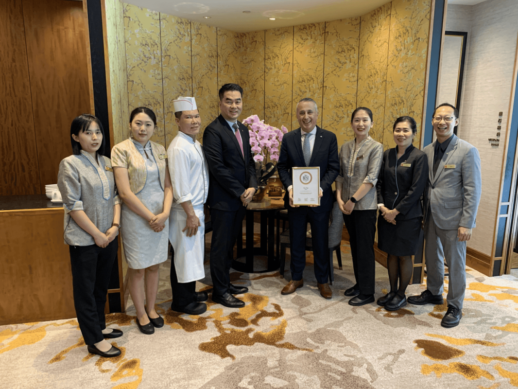 The Hua Ting team gathers with the restaurant's Tatler Best Spotlight 2026 certificate.