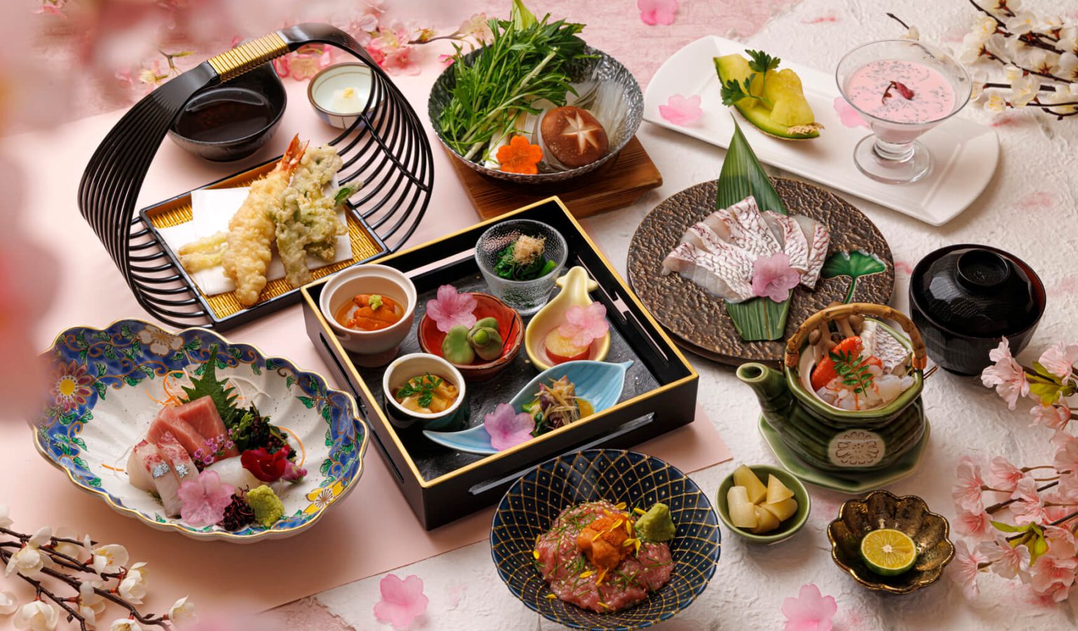 Assorted seasonal appetisers open the Sakura Kaiseki at Sagano, featuring Toyama Squids with Sour Miso Paste, Marinated White Shrimps and Sea Urchin with Sake, and Stewed Sweet Potatoes with Lemon Sauce.