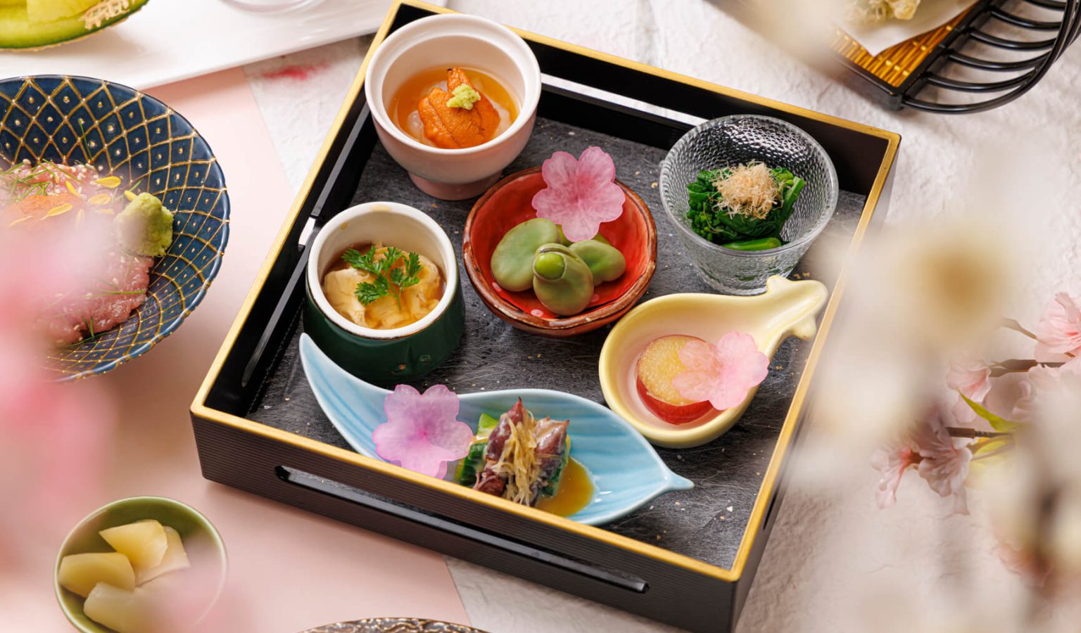 The Sakura Kaiseki progresses through sashimi and Sakura Sea Bream Hotpot, each course building on the seasonal Japanese theme that runs through the seven-course sequence.