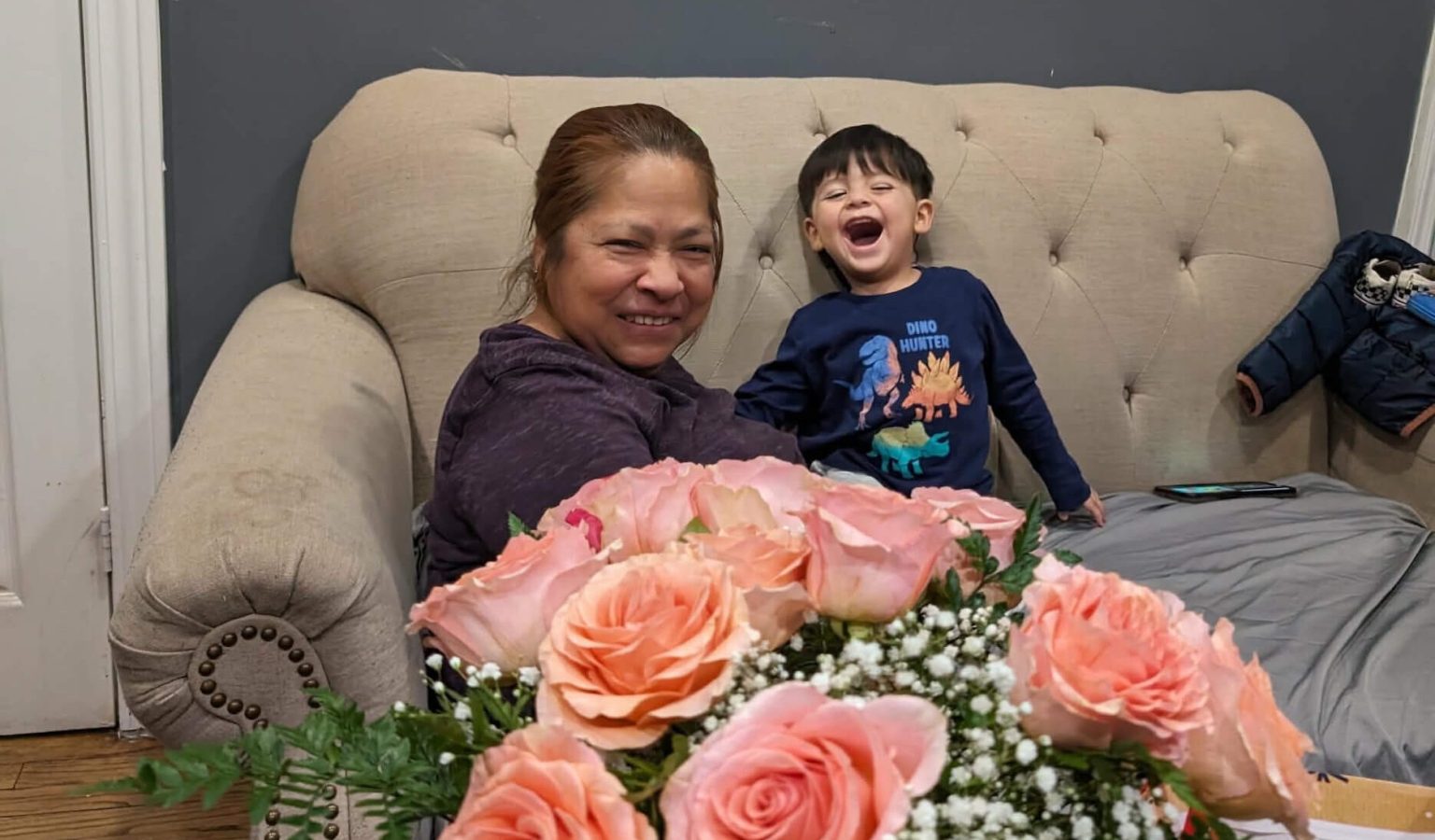 Sara with her youngest grandson Aneken, just four years old, a reminder of the family that keeps her grounded beyond the hotel walls.